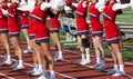 High school cheerleaders cheering during football game