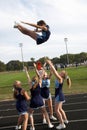 High school cheerleaders perform during a football game in Chesepeake, Maryland