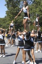 High school cheerleaders perform a performance at a Labor Day Festival