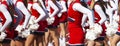 Cheerleaders with pom poms cheering at football game