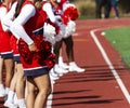 Cheerleaders on the track during a football game Royalty Free Stock Photo