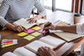 High school or college student group sitting at desk in library studying and reading, doing homework and lesson practice preparing Royalty Free Stock Photo