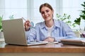 High school, college student smiling young female sitting at desk with computer Royalty Free Stock Photo
