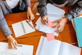 High school or college students  group catching up workbook and learning tutoring on desk and reading, doing homework, lesson Royalty Free Stock Photo