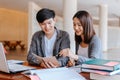 High school or college students  group catching up workbook and learning tutoring on desk and reading, doing homework, lesson Royalty Free Stock Photo