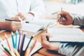 High school or college students studying and reading together in library Royalty Free Stock Photo