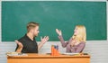 High school education. Couple studying in classroom. Man and woman back to school. Pretty teacher and handsome Royalty Free Stock Photo