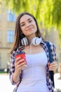 High school education student college break rest relax recreation concept. Happy cheerful smiling young student listening to music