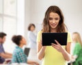 Student girl using tablet computer at school Royalty Free Stock Photo