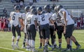 High school football players huddling