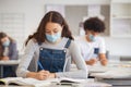 High school girl studying in class with face mask Royalty Free Stock Photo