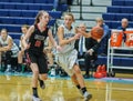 High school girls basketball players in action