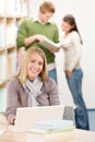 High school library - happy student with laptop Royalty Free Stock Photo