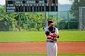 High school pitcher looking for signals from catcher. Royalty Free Stock Photo