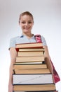 High school schoolgirl student with stack books Royalty Free Stock Photo