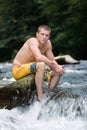 High School Senior On Rock In River