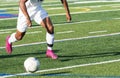 Soccer player in white uniform running after the ball Royalty Free Stock Photo