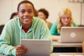 High School Student At Desk In Class Using Digital Tablet Royalty Free Stock Photo