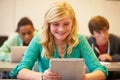 High School Student At Desk In Class Using Digital Tablet Royalty Free Stock Photo