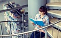 High school student girl reading book at library Royalty Free Stock Photo