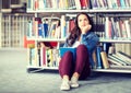 High school student girl reading book at library Royalty Free Stock Photo