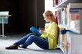 High school student girl reading book at library Royalty Free Stock Photo