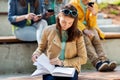 High school student girl reading book outdoors Royalty Free Stock Photo