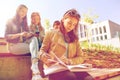 High school student girl reading book outdoors Royalty Free Stock Photo