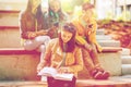 High school student girl reading book outdoors Royalty Free Stock Photo