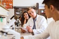 High school student with microscopes in laboratory. Royalty Free Stock Photo
