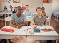 High school, students and boys listening in classroom of education, learning or knowledge. Highschool, studying and Royalty Free Stock Photo