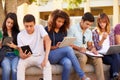 High School Students Collaborating On Project On Campus Royalty Free Stock Photo