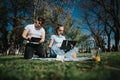 High school students collaborating on a project outdoors on a sunny day Royalty Free Stock Photo