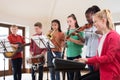 High School Students Playing In School Orchestra Together