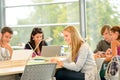 High- school students studying in library together Royalty Free Stock Photo