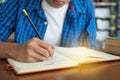 High school students are writing books in the library Royalty Free Stock Photo