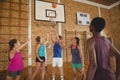 High school team scoring a goal while playing basketball Royalty Free Stock Photo