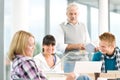 High school - three students with mature professor Royalty Free Stock Photo