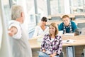 High school - three students with mature professor Royalty Free Stock Photo