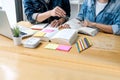 High school tutor or college student group sitting at desk in library studying and reading, doing homework and lesson practice