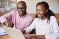 High School Tutor Giving Female Student One To One Tuition At Desk Royalty Free Stock Photo