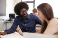 High School Tutor Giving Female Student One To One Tuition At Desk In Classroom Royalty Free Stock Photo