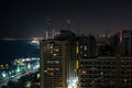 High shot of Abu Dhabi skyline and city towers at night, Corniche view