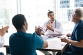 High-skilled mixed race medical people celebrating in hospital office successful victory. Royalty Free Stock Photo