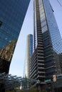 Skyscraper building with reflecting glass facade in downtown Vancouver, Canada, vertical shot Royalty Free Stock Photo