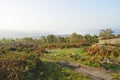 From the slopes of Surprise View over a misty Derbyshire landscape