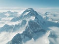 High snow-capped mountain peak among clouds Royalty Free Stock Photo
