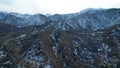 High snowy peaks stand in the distance. Drone view