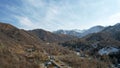 High snowy peaks stand in the distance. Drone view