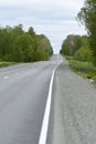 High-speed asphalt road in the spring forest. Country road Royalty Free Stock Photo